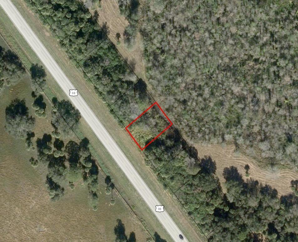 An aerial map view shows a rectangular property lot outlined in red along a highway — 3584 US Highway 98, Okeechobee FL 34972, OKEECHOBEE, FL