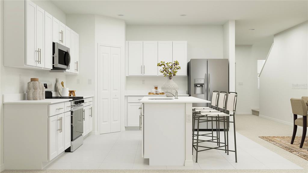 This is a rendering of a modern kitchen with white cabinets, an island, and appliances — 2731 LOOKOUT RIDGE ROAD, HAINES CITY, FL