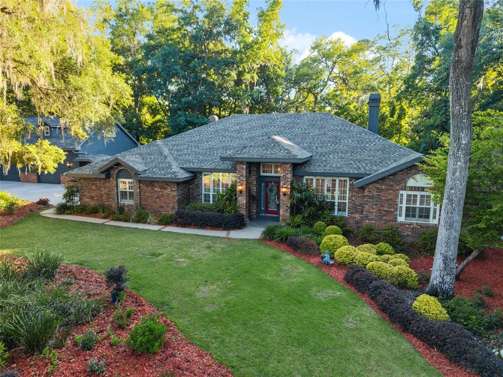 This collage shows a garage bonus room with a kitchenette, bathroom, and living area — 2512 NW 58TH BOULEVARD, GAINESVILLE, FL