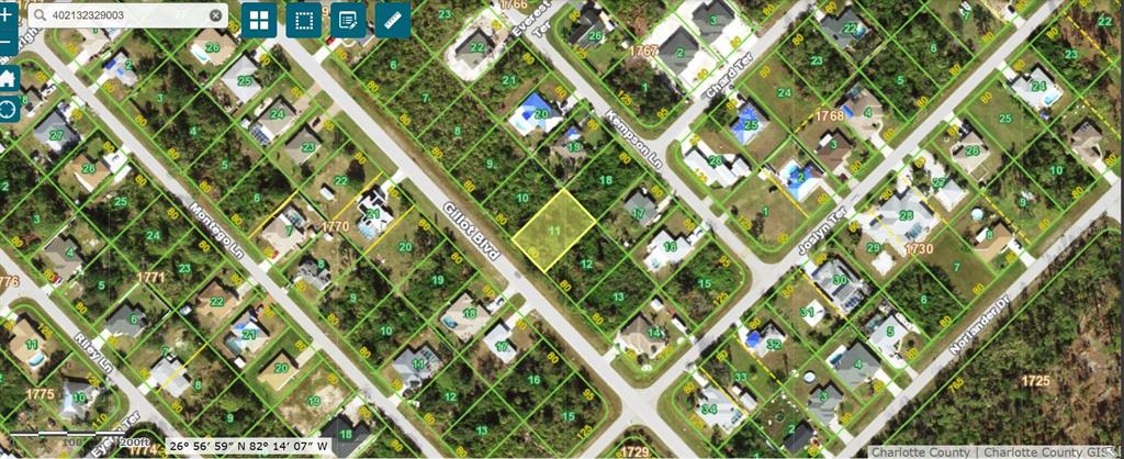 This is a satellite map showing a vacant residential lot highlighted in yellow — 5560 GILLOT BOULEVARD, PORT CHARLOTTE, FL