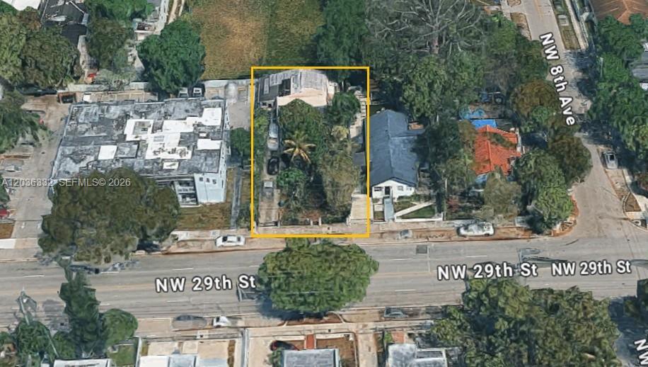 An aerial view shows a rectangular property lot outlined in yellow along a city street — 821 NW 29th St, Miami FL 33127, MIAMI, FL