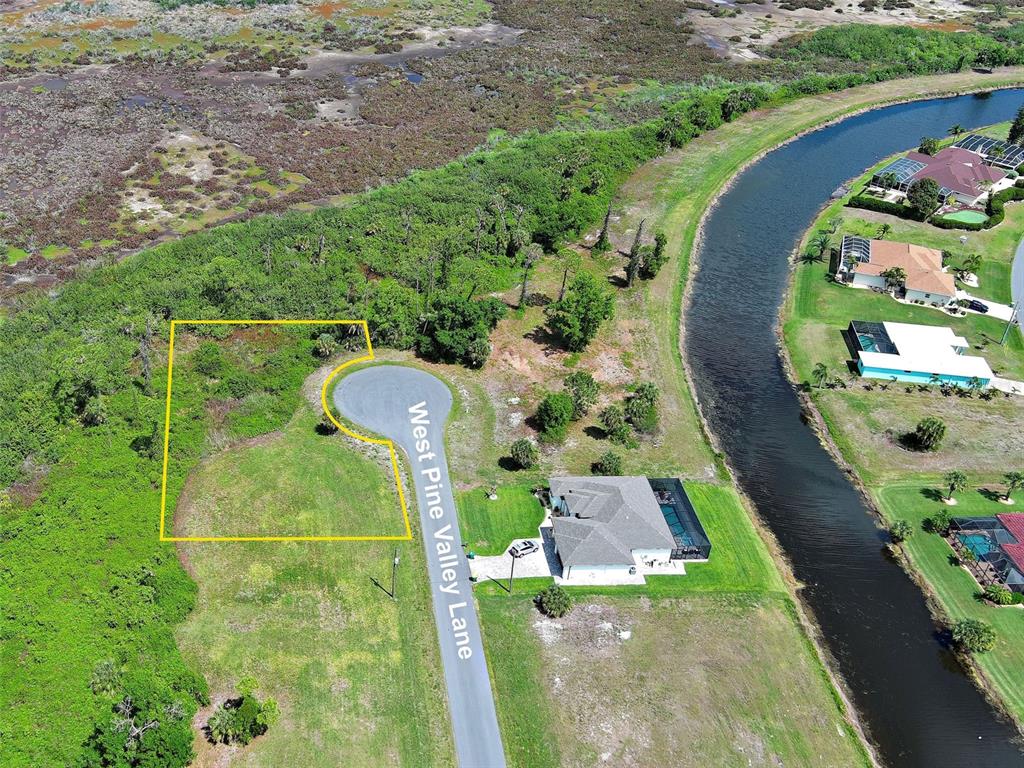 An aerial view shows a vacant residential lot outlined in yellow at the end of a cul-de-sac — 171 W PINE VALLEY LANE, ROTONDA WEST, FL