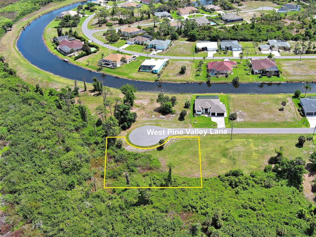 An aerial view shows a vacant residential lot outlined in yellow at a cul-de-sac — 171 W PINE VALLEY LANE, ROTONDA WEST, FL
