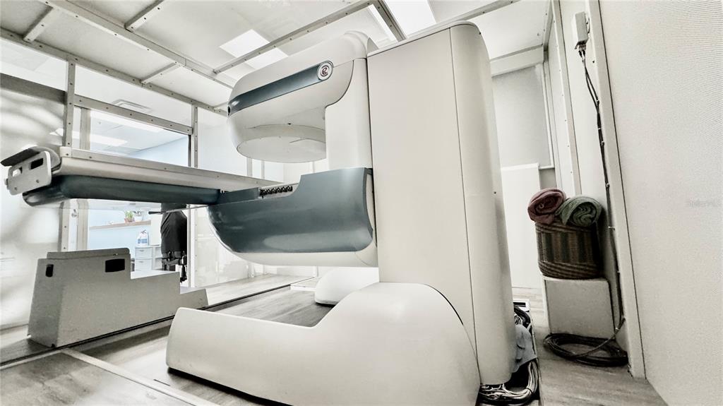 A medical imaging room features a large white diagnostic scanner and a patient examination table — 2301 STATE ROAD 524 UNIT A135, COCOA, FL
