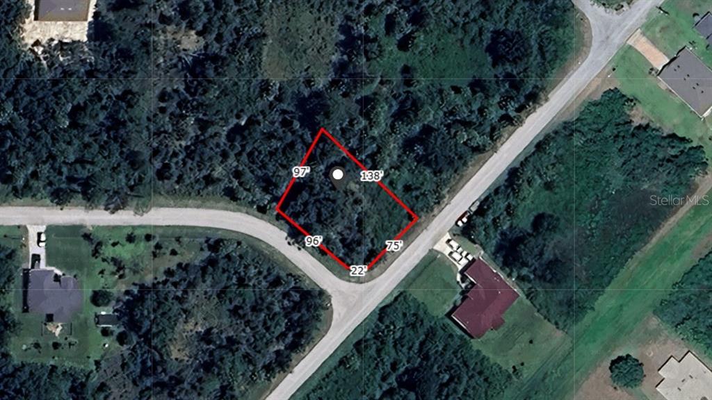 An aerial view shows a vacant, wooded lot outlined in red with labeled property dimensions — JINRIGHT ROAD, NORTH PORT, FL
