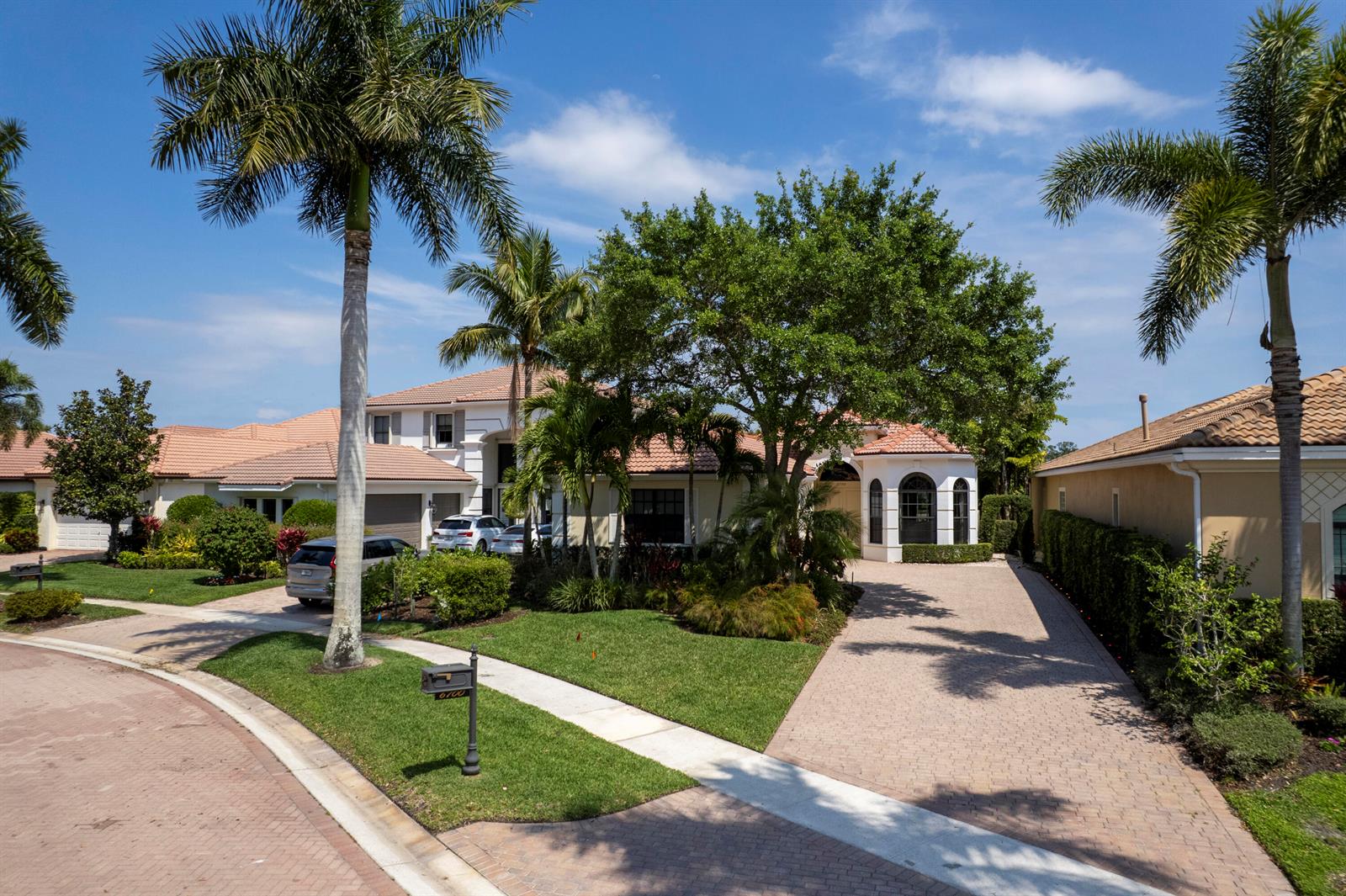 A two-story house with a tiled roof, palm trees, and a paved driveway — 6700 Fox Hollow Drive, West Palm Beach FL 33412, WEST PALM BEACH, FL