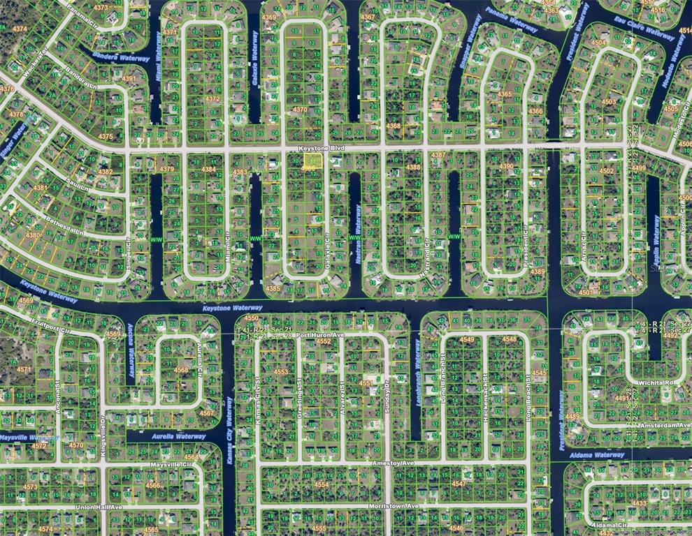 This is a satellite map showing a residential neighborhood with canals and street layouts — 9477 GALAXIE CIRCLE, PORT CHARLOTTE, FL