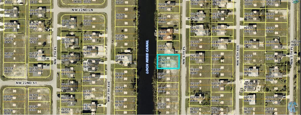 This is a map showing a vacant residential lot highlighted in blue along a canal — 2204 NW 6TH PLACE, CAPE CORAL, FL
