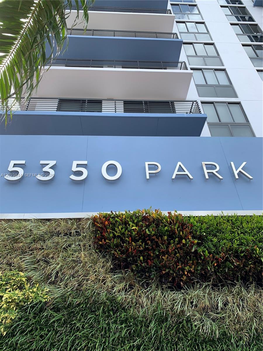 A low-angle view shows the exterior of a building with the sign 5350 PARK — 5350 NW 84 Ave # 1601, Doral FL 33166, DORAL, FL