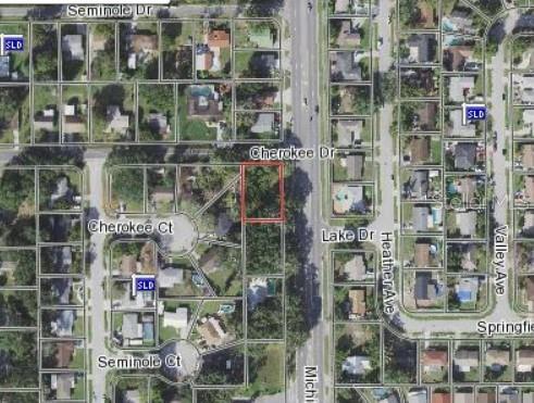 This is an aerial map view showing a vacant residential lot outlined in red — MICHIGAN AVENUE, KISSIMMEE, FL