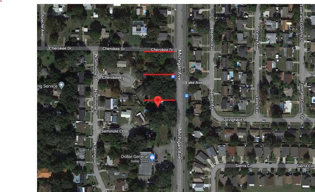 This is an aerial map showing a vacant lot highlighted in red along Michigan Avenue — MICHIGAN AVENUE, KISSIMMEE, FL