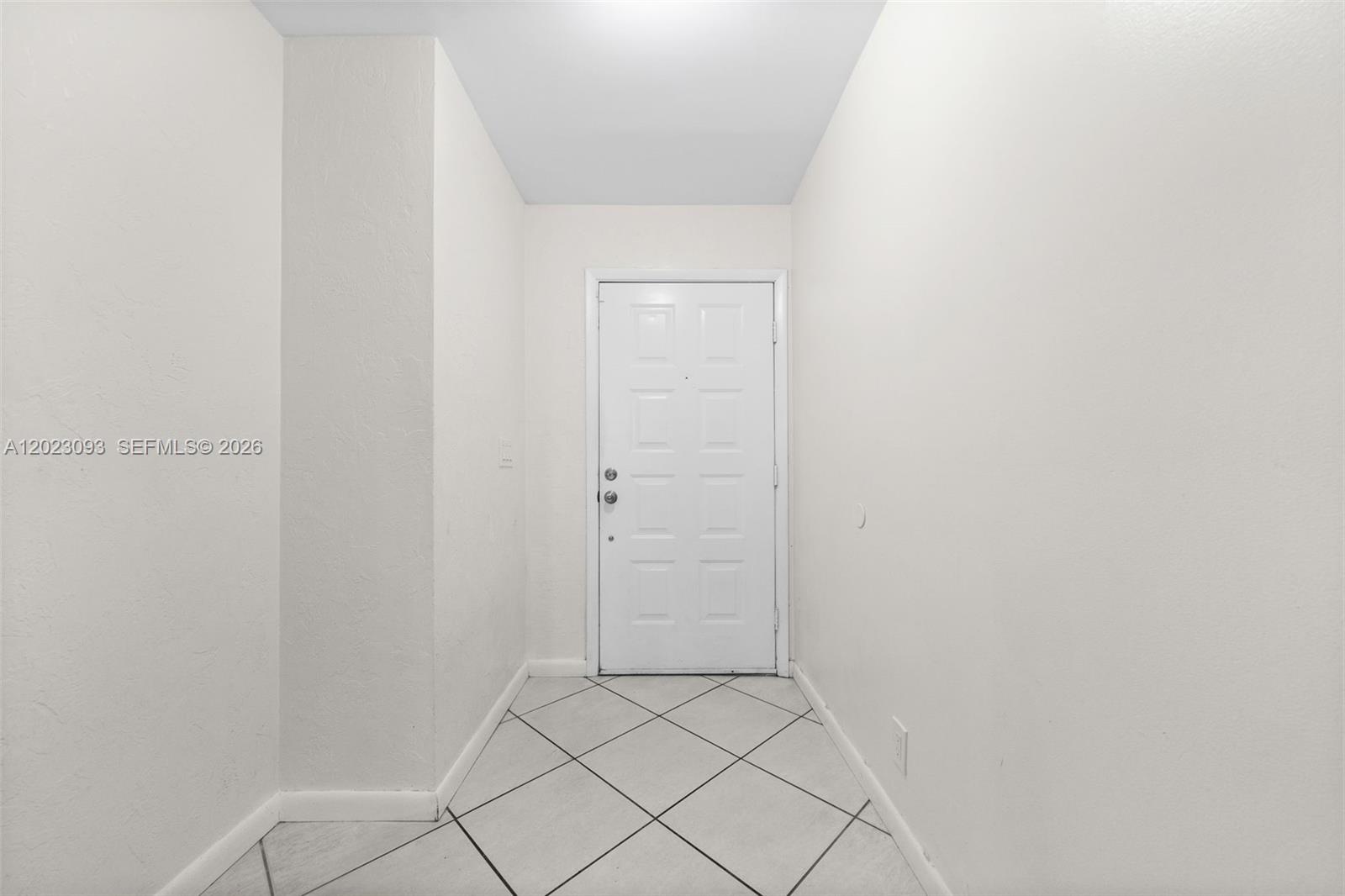 A white entryway features a white door, light-colored walls, and diagonal tile flooring — 4241 SW 71st Way # 4241, Davie FL 33314, DAVIE, FL