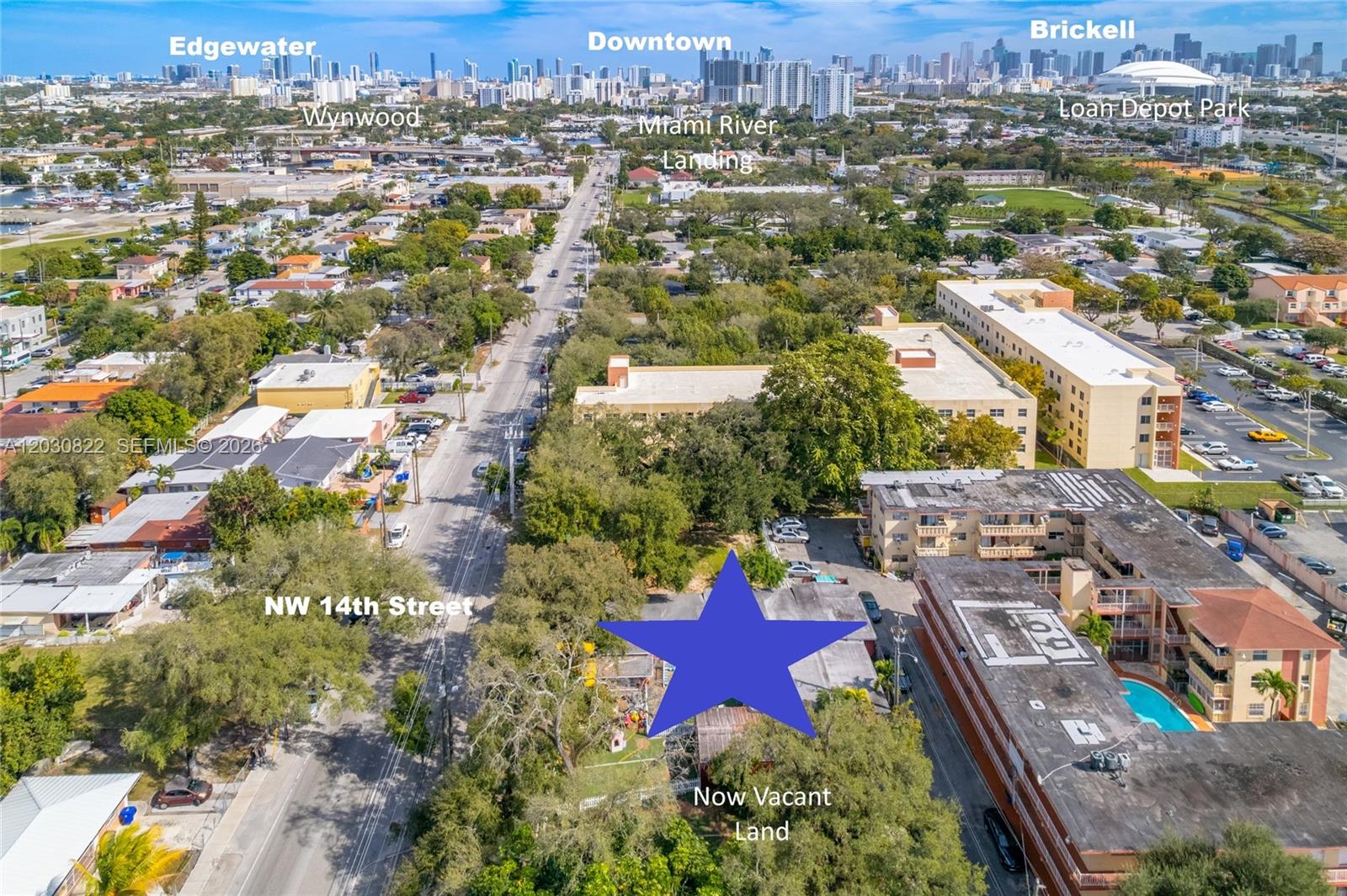 This aerial view shows a vacant lot marked with a blue star near a street — 2470 NW 14th St, Miami FL 33125, MIAMI, FL