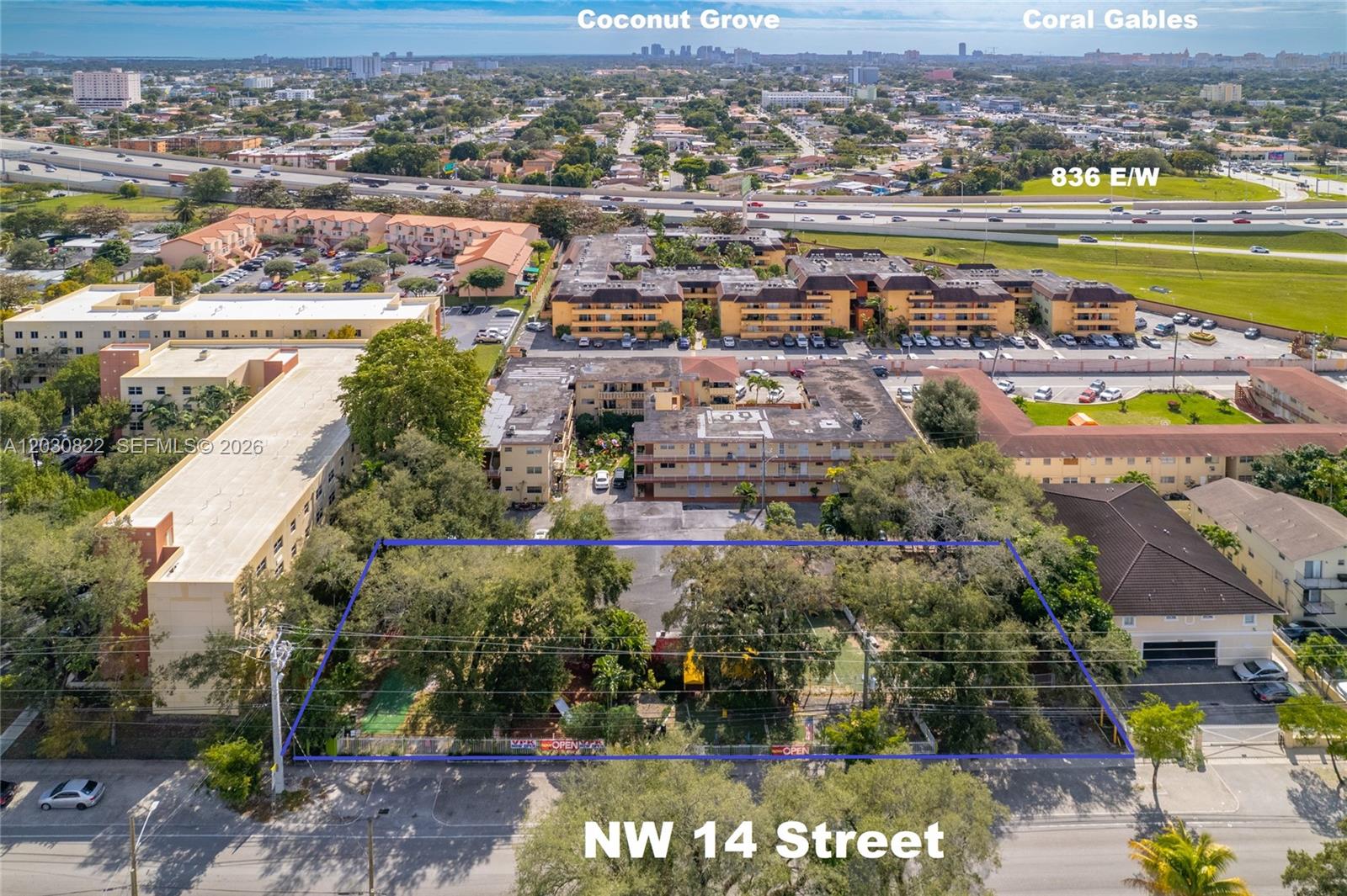 An aerial view shows a rectangular, tree-filled lot bordered by a blue outline on a street — 2470 NW 14th St, Miami FL 33125, MIAMI, FL