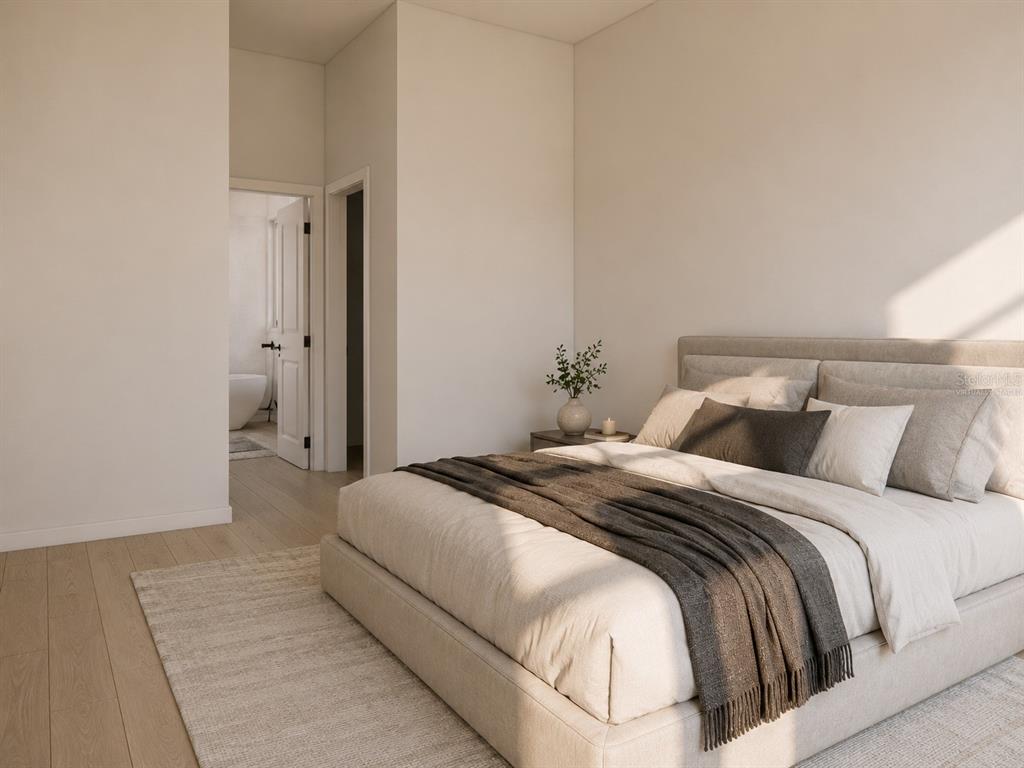This is a digital rendering of a modern bedroom with a bed and an attached bathroom — 13855 SW 33RD COURT ROAD, OCALA, FL