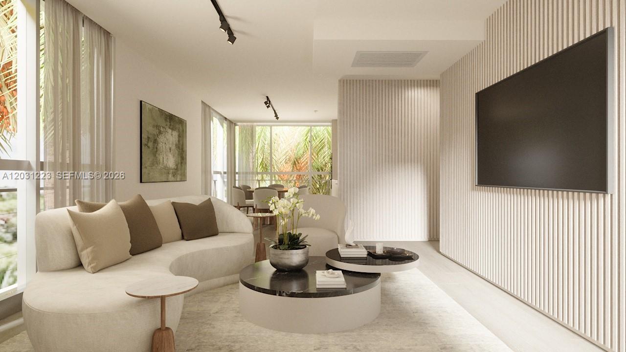 This is a rendering of a modern living room featuring a curved sofa and slatted walls — 260 Collins Ave # 303, Miami Beach FL 33139, MIAMI BEACH, FL