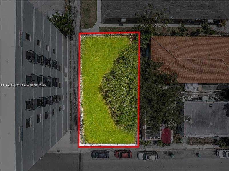 An aerial view shows a rectangular vacant lot outlined in red between two buildings — 129 SW 21st Ave, Miami FL 33135, MIAMI, FL