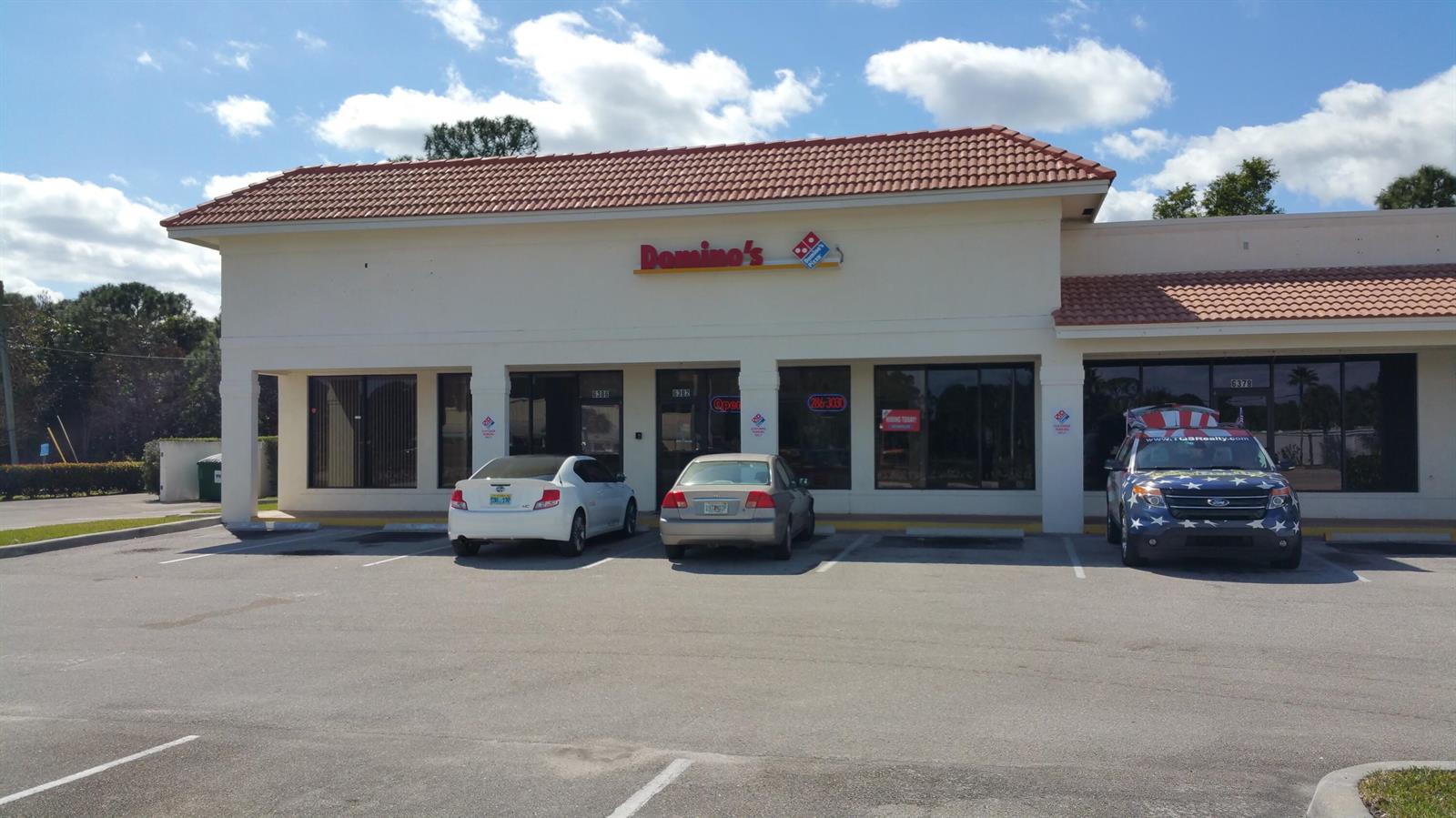 A Domino's restaurant exterior with a parking lot and a patriotic-themed vehicle parked in front — 6366 SE Federal Highway # 6378a, Stuart FL 34997, STUART, FL