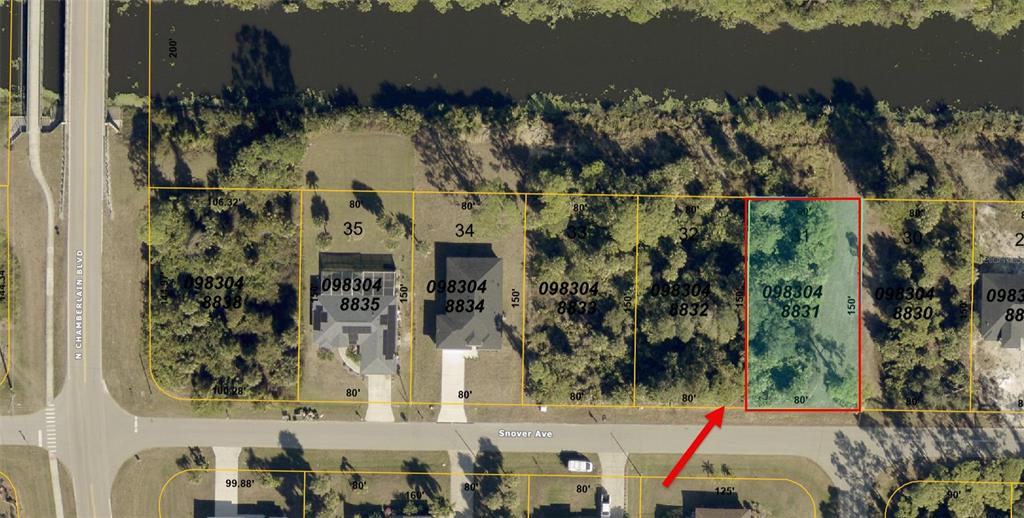 This is an aerial map showing a vacant residential lot highlighted in red — SNOVER AVENUE, NORTH PORT, FL