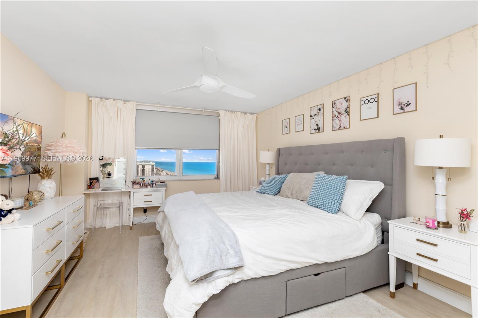 A bedroom features a gray upholstered bed, white furniture, and a window with ocean views — 2101 S Ocean Dr # 2804, Hollywood FL 33019, HOLLYWOOD, FL