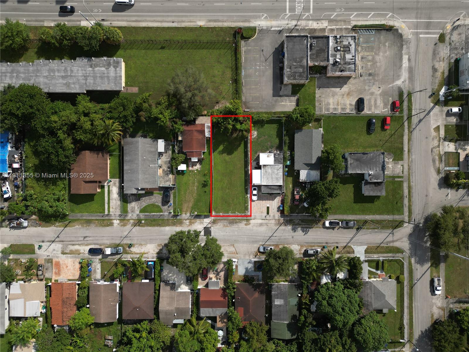 An aerial view shows a vacant rectangular lot outlined in red between two residential houses — 2368 NW 55th St, Miami FL 33142, MIAMI, FL