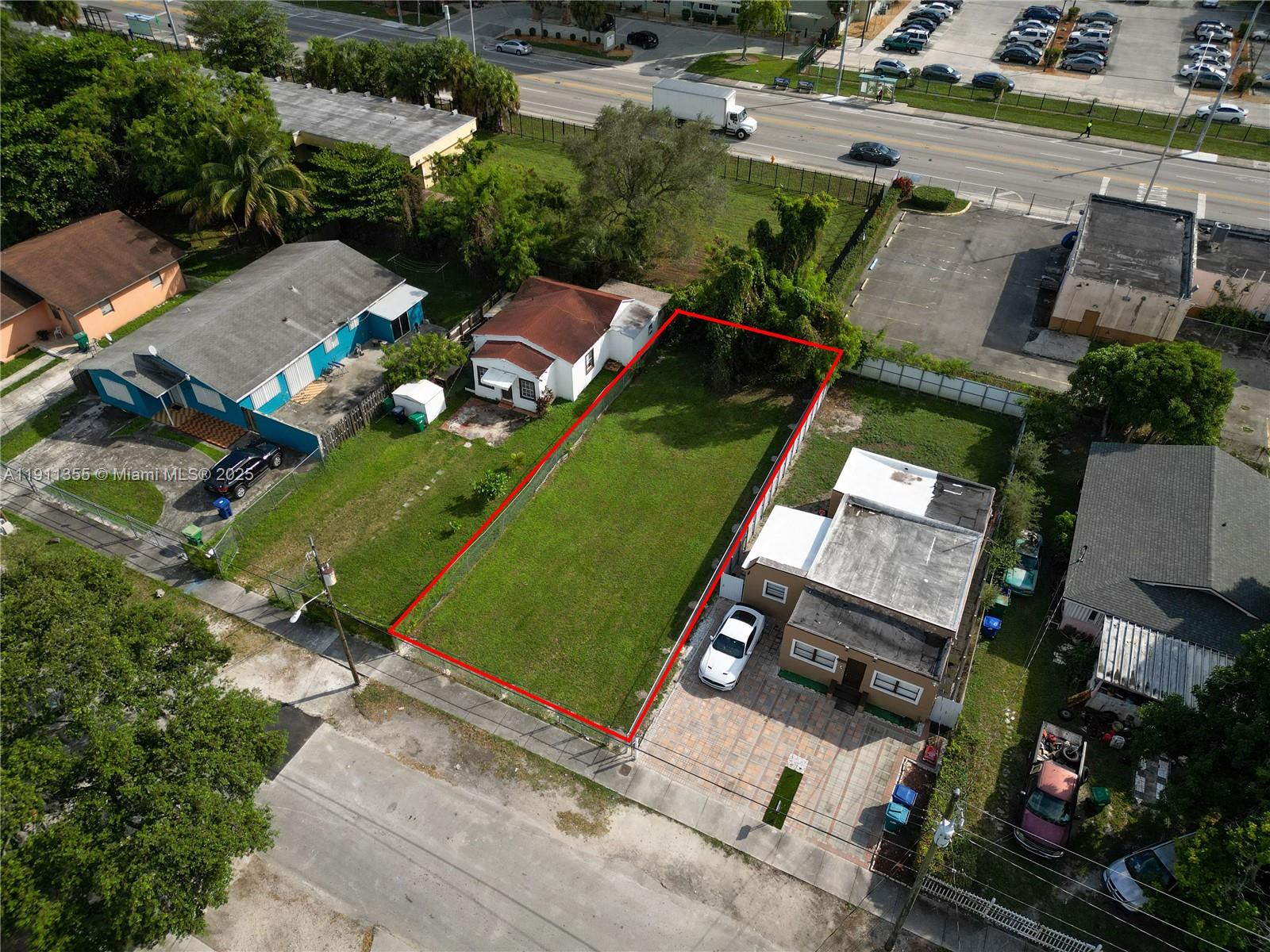 An aerial view shows a rectangular vacant lot outlined in red between two residential houses — 2368 NW 55th St, Miami FL 33142, MIAMI, FL
