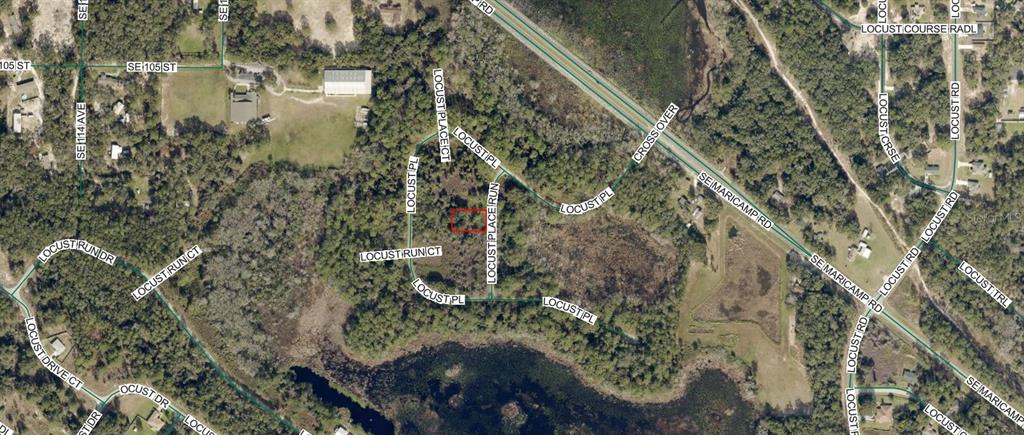 This is an aerial map showing a vacant lot outlined in red near Locust Place — 9034-1049-03 LOCUST PLACE RUN, OCALA, FL