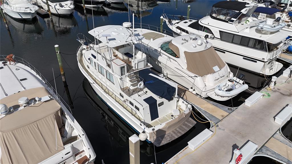 An aerial view shows several yachts docked at a marina on a sunny day — 102 RIVIERA DUNES WAY UNIT S-54, PALMETTO, FL