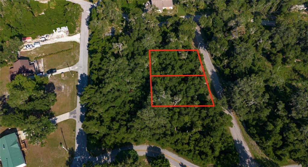 An aerial view shows two adjacent wooded rectangular lots outlined in red near a road — 4362 E MATE LANE, HERNANDO, FL
