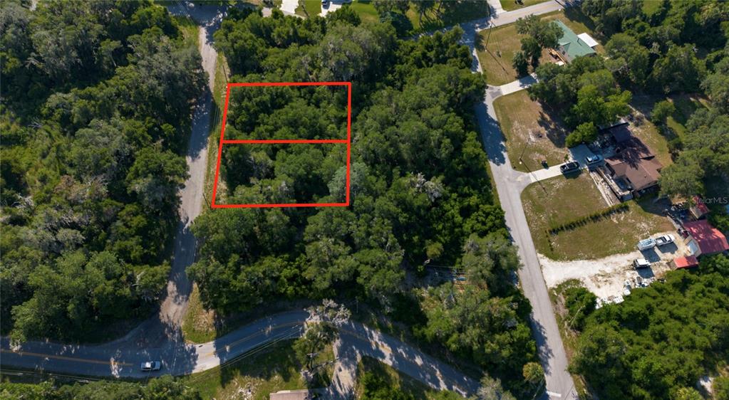 An aerial view shows two adjacent wooded lots outlined in red near a paved road — 4362 E MATE LANE, HERNANDO, FL