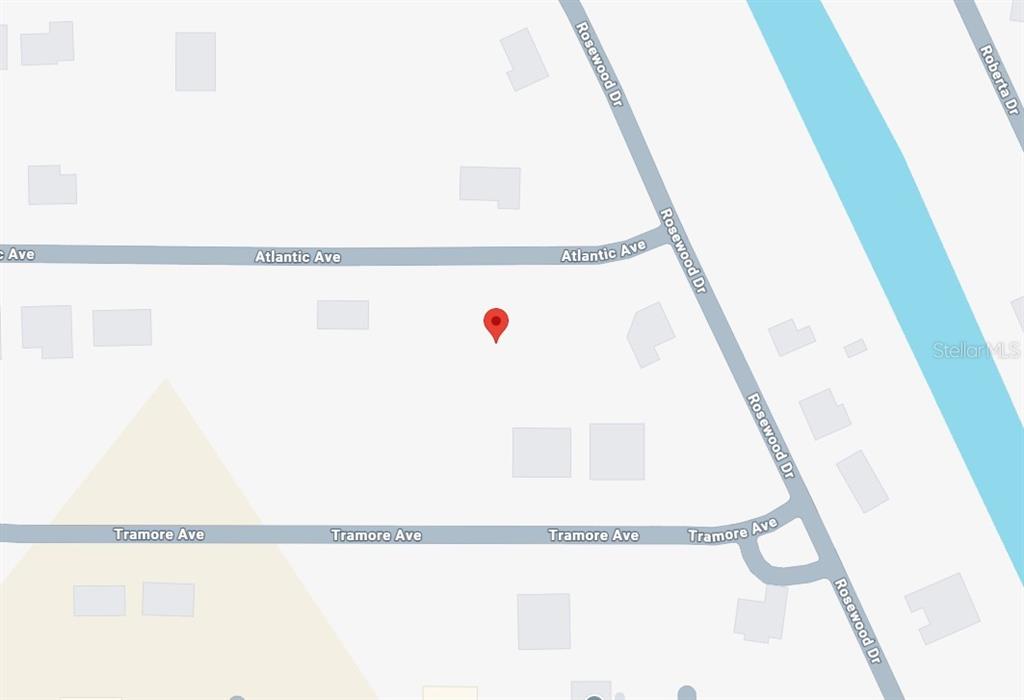 This is a map showing a red location pin near the intersection of Atlantic Avenue and Rosewood Drive — 10185 ATLANTIC AVENUE, ENGLEWOOD, FL