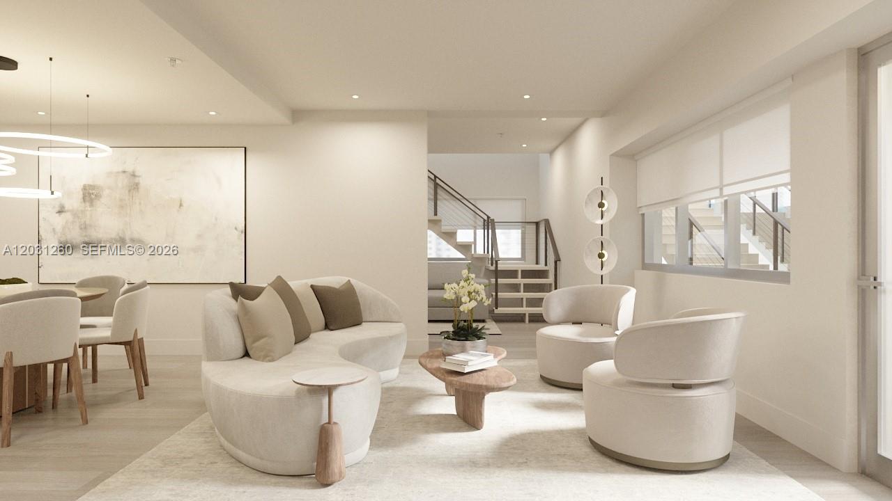 This is a rendering of a modern living room with curved furniture and neutral tones — 250 Collins Ave # 207, Miami Beach FL 33139, MIAMI BEACH, FL
