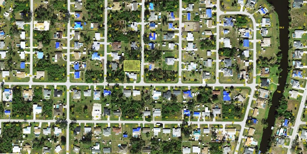 This is an aerial map showing a highlighted vacant residential lot in a suburban neighborhood — 3327 JAMESTOWN STREET, PORT CHARLOTTE, FL