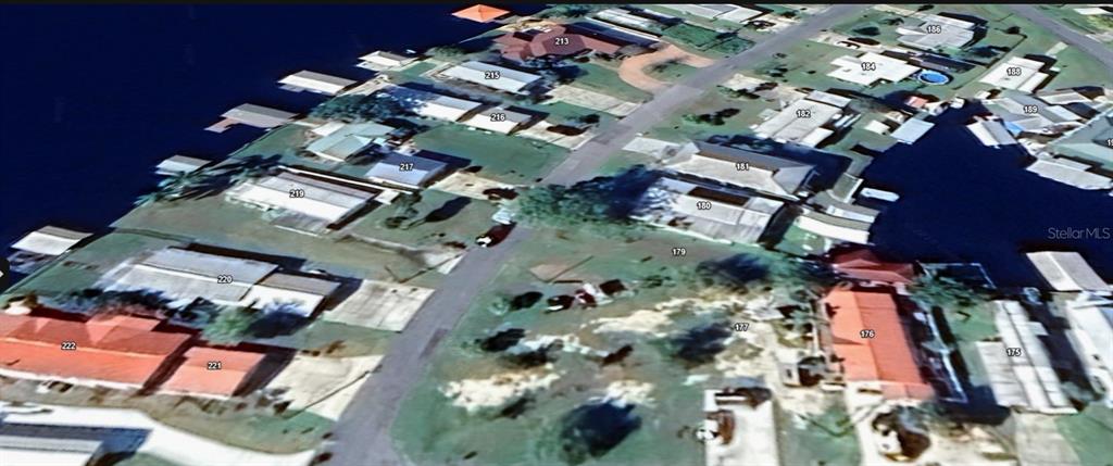 This aerial map view shows a residential neighborhood with waterfront homes and boat docks — 179 SPORTSMAN DRIVE, WELAKA, FL