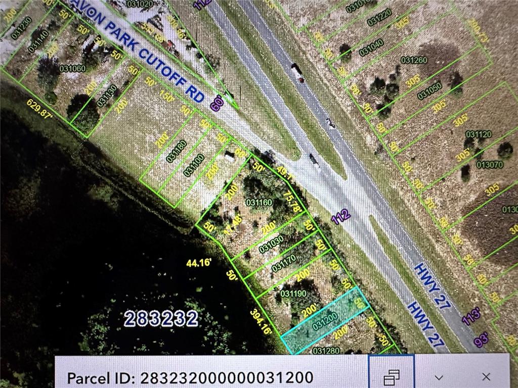 This is a satellite map showing property parcel boundaries and dimensions along a highway — 0 US HIGHWAY 27, FROSTPROOF, FL
