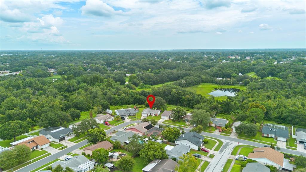 An aerial view shows a suburban neighborhood with a red location pin over a house — 629 STILLVIEW CIRCLE, BRANDON, FL