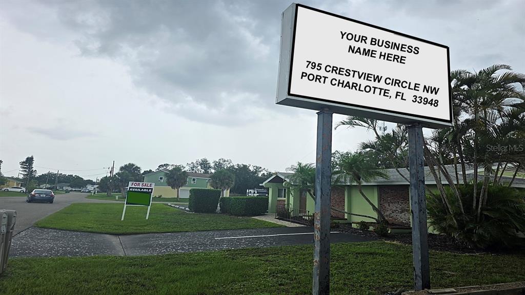A commercial sign stands in front of a building with a for sale sign nearby — 795 CRESTVIEW CIRCLE NW, PORT CHARLOTTE, FL