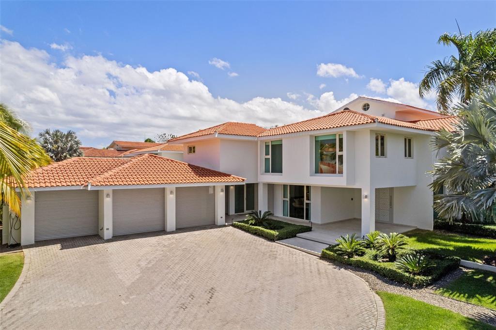 A two-story white house with a red tile roof and a three-car garage — 336 DORADO BEACH EAST, DORADO, PR