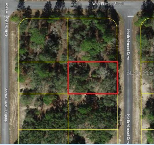 This aerial map shows a rectangular plot of land outlined in red among wooded lots — 6692 N AIRMONT DRIVE, DUNNELLON, FL