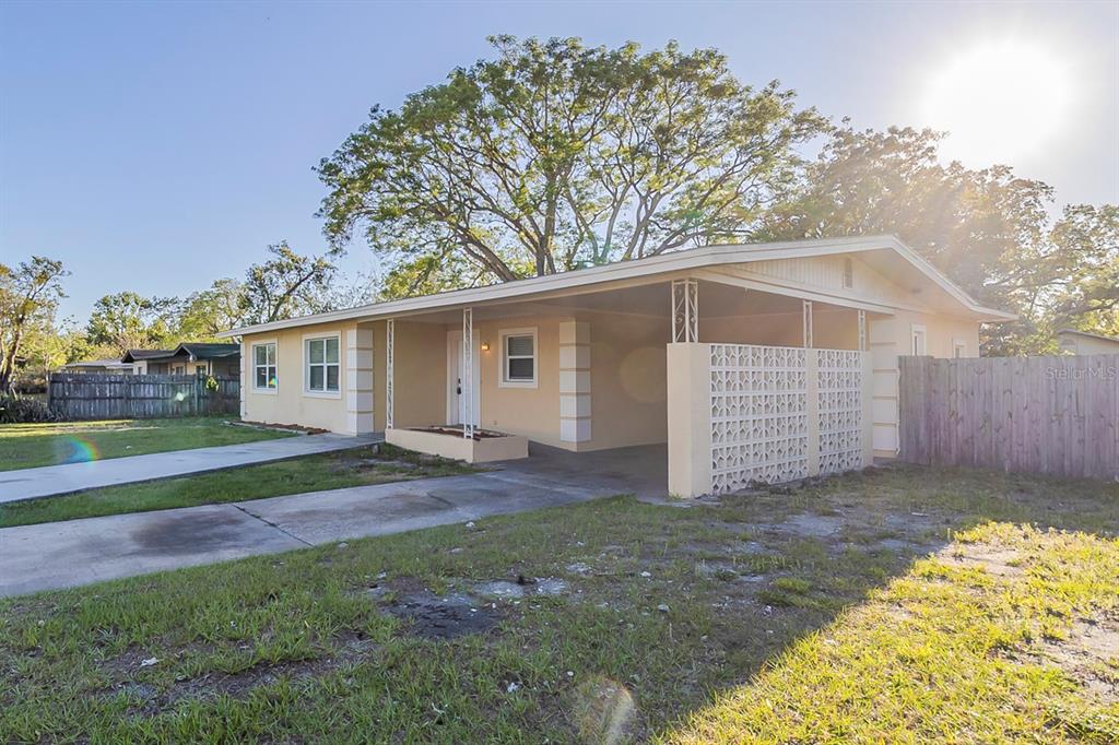 A single-story house with a carport, a decorative screen wall, and a concrete driveway — 4320 MEADOWBROOK AVENUE, ORLANDO, FL