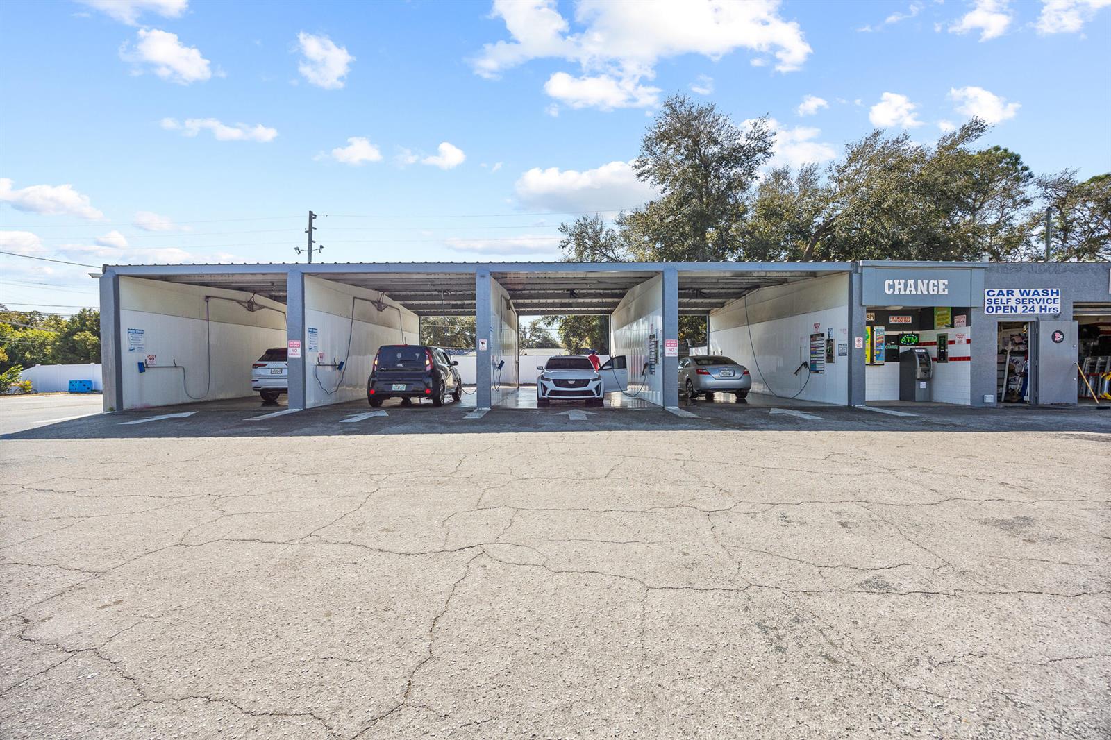 A self-service car wash facility with four bays and an adjacent change machine area — 11500 Walsingham Road, Largo FL 33778, LARGO, FL