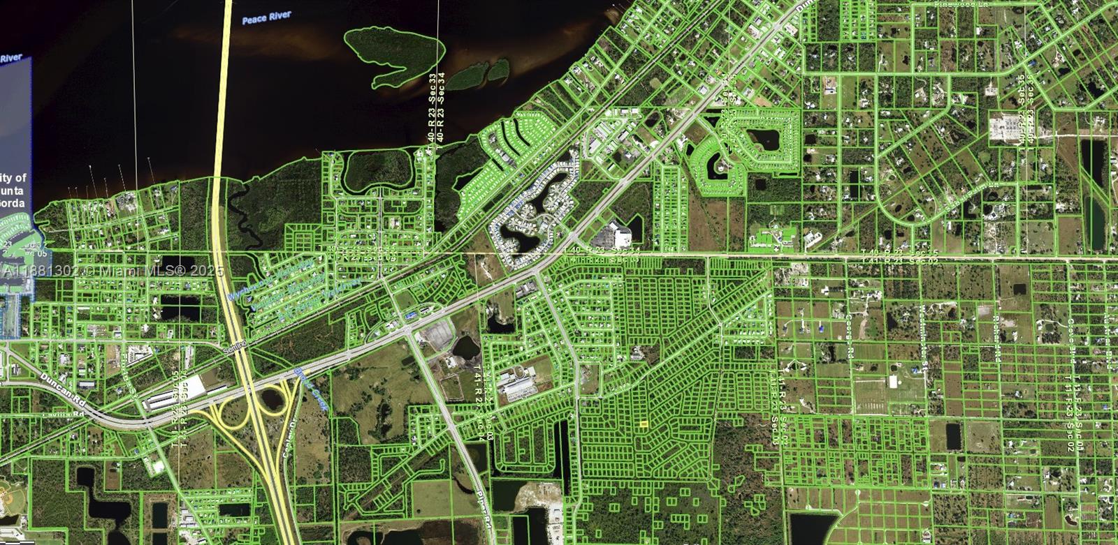 This is an aerial map showing residential street layouts and land parcels near a river — 921 Yellowtail Lane, Punta Gorda FL 33982, PUNTA GORDA, FL