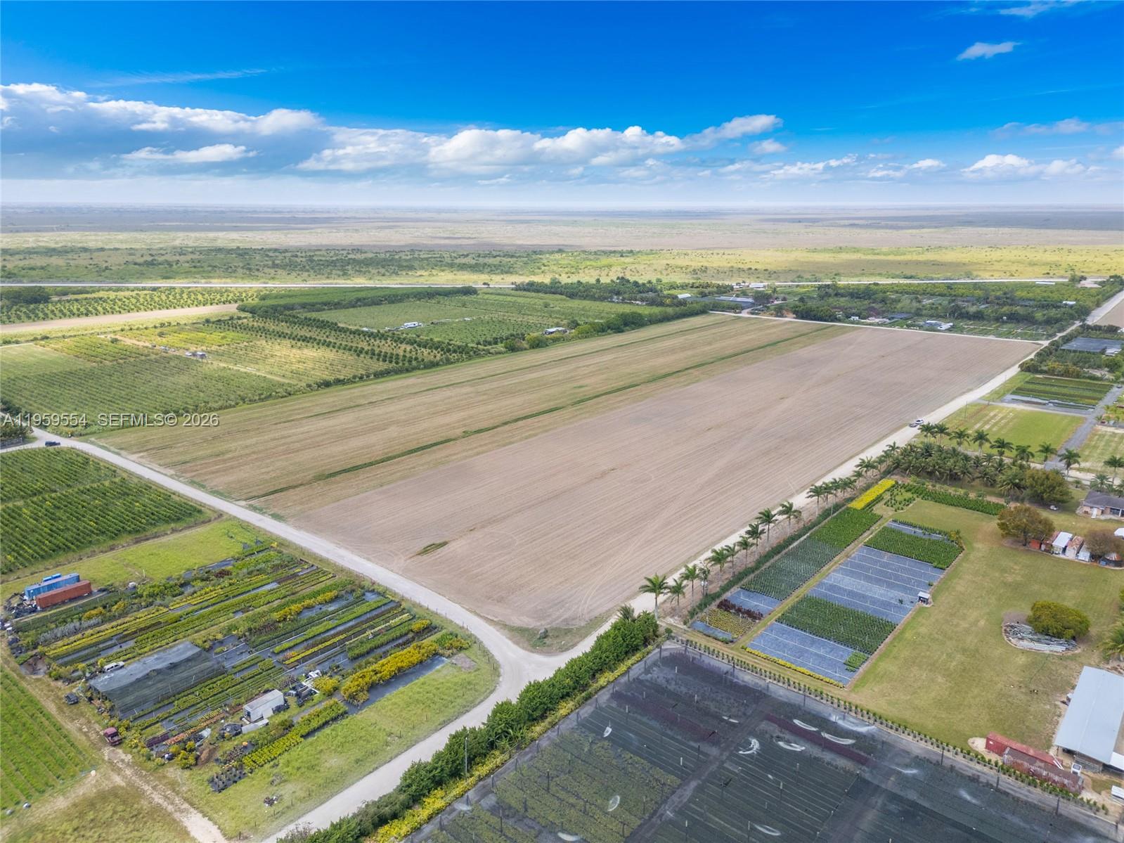 An aerial view shows a large, flat agricultural field bordered by nursery plots and roads — 224XX sw 217 ave, Miami FL 33170, MIAMI, FL