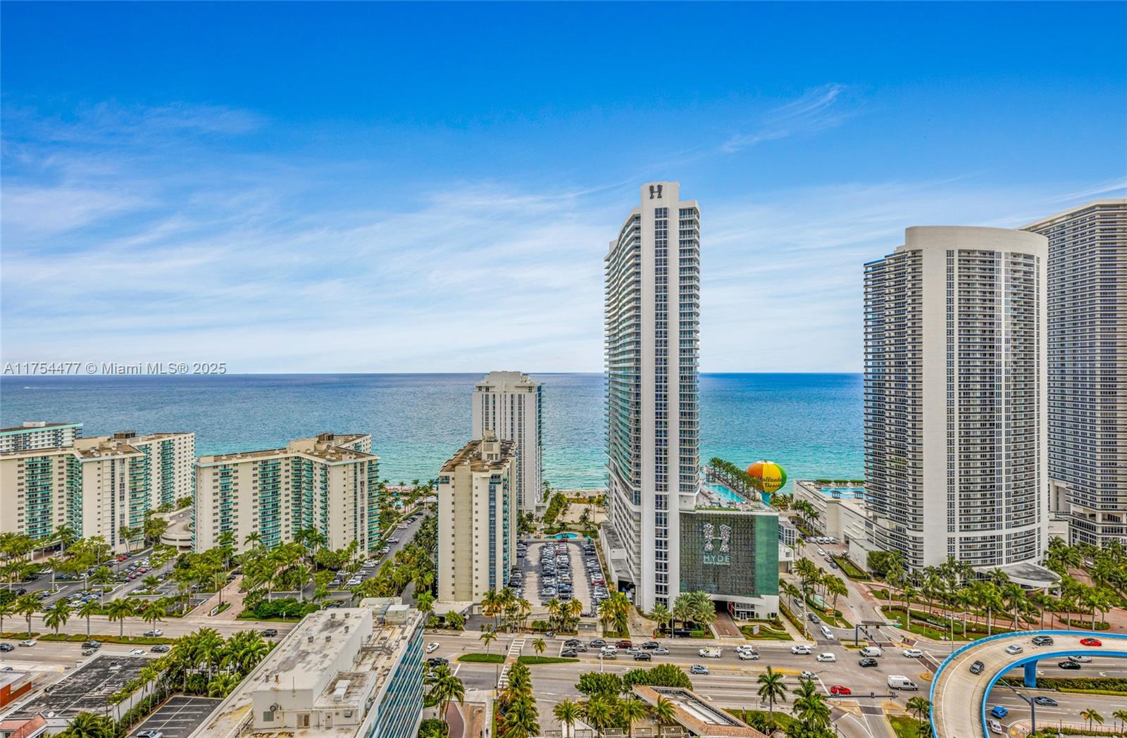 An elevated exterior view shows high-rise residential buildings along a beach with ocean views — 4010 S Ocean Dr # R2505, Hollywood FL 33019, HOLLYWOOD, FL