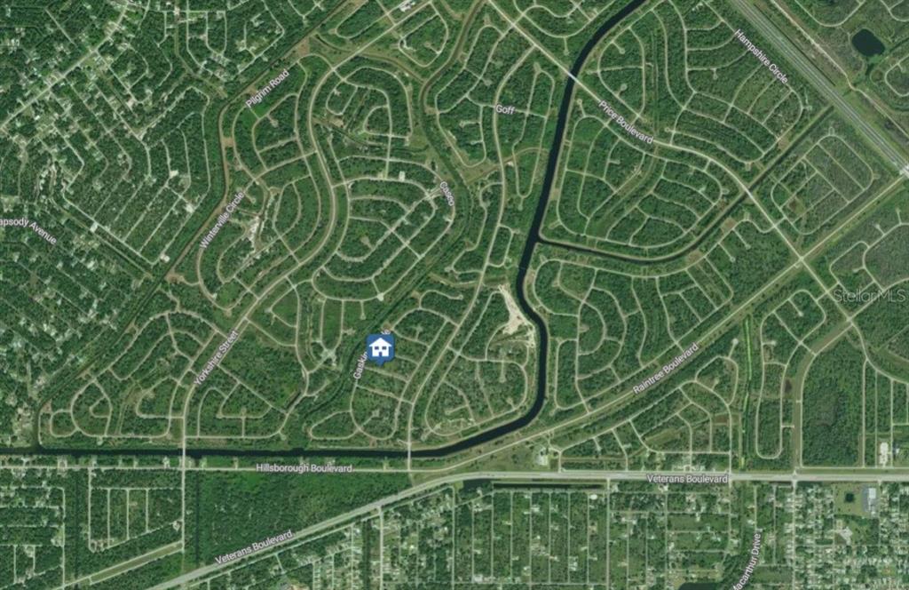 This is an aerial map showing a residential neighborhood with a highlighted property location — Lot 14 MORRISETTE LANE, NORTH PORT, FL