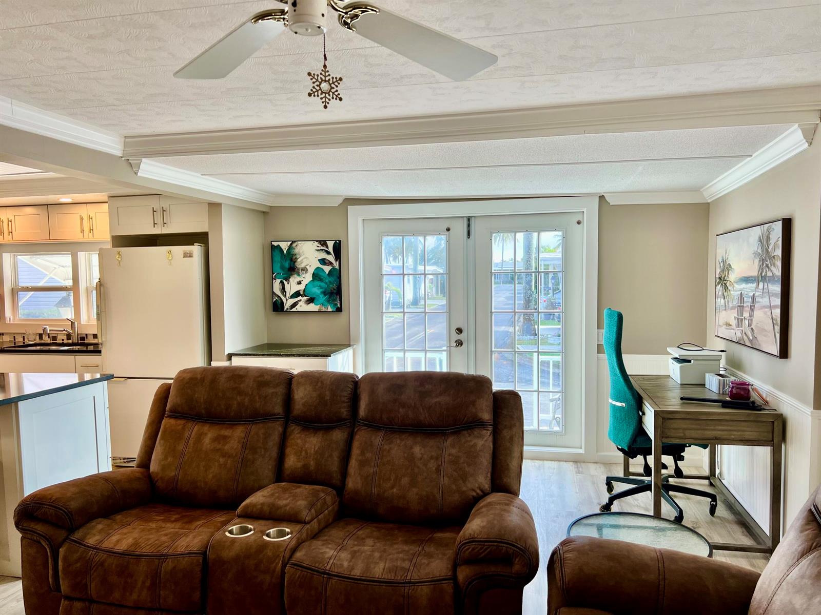 A living room features a brown reclining sofa, a desk with a teal chair, and doors — 1554 S 33rd Road, Hollywood FL 33021, HOLLYWOOD, FL