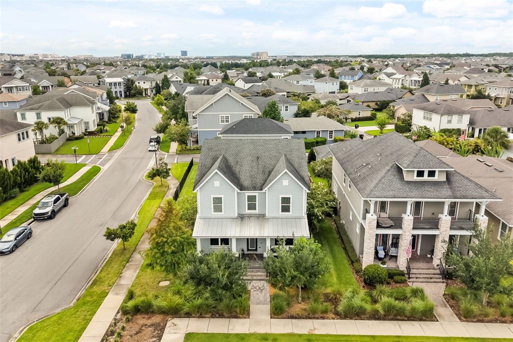 An aerial view shows two adjacent suburban houses with gray siding and shingled roofs — 13785 BEHRING AVENUE, ORLANDO, FL