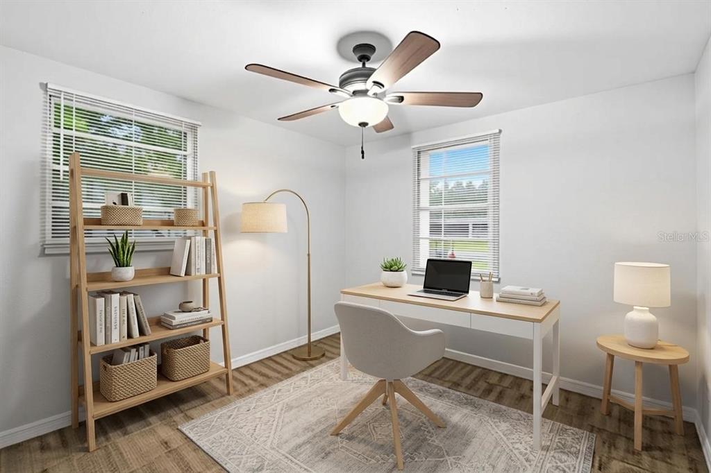 A home office features a wooden desk, a bookshelf, a ceiling fan, and two windows — 3008 N 43RD STREET, TAMPA, FL