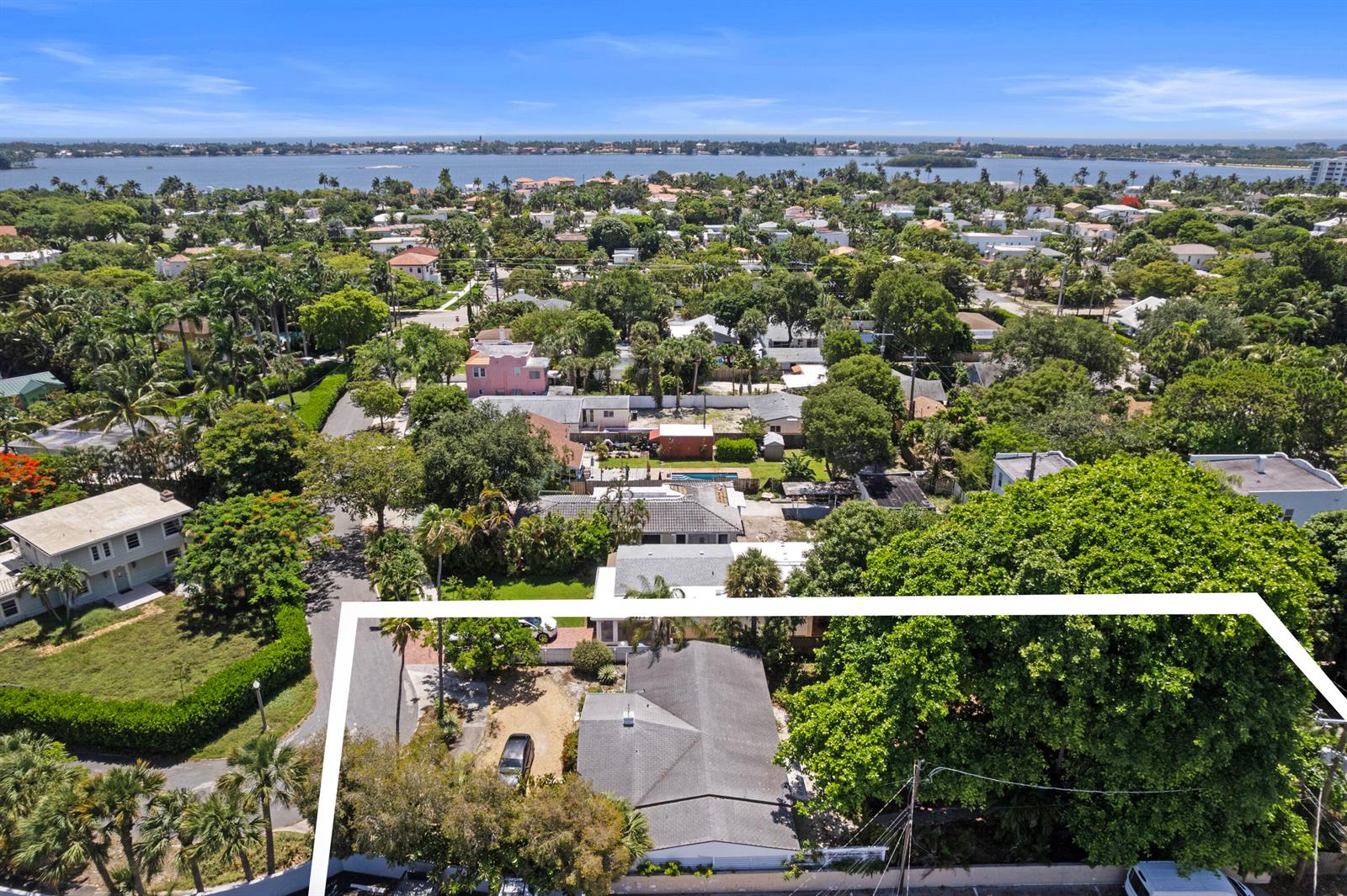 An aerial view shows a residential property with a house, driveway, and large trees — 330 Marlborough Place, West Palm Beach FL 33405, WEST PALM BEACH, FL