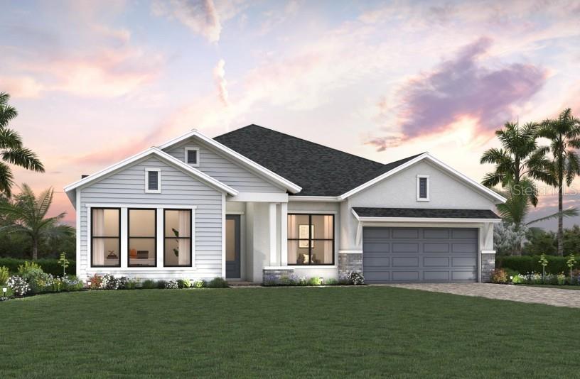 A single-story house with light siding, a stone-accented garage, and a paved driveway — 7245 MEADOWSHADE COURT, SARASOTA, FL
